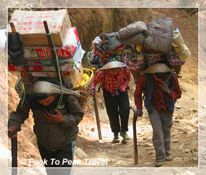 Local people carrying supplies